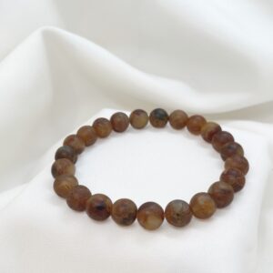 Bransoletka z kulek bursztynu koniakowo‑mlecznego