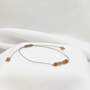 Bransoletka z kuleczek bursztynowych ze złotem 585 na beżowym sznurku